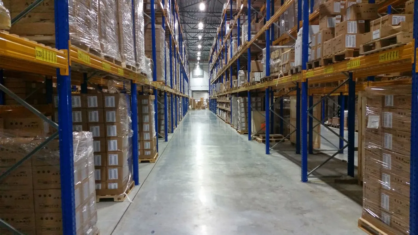 Shelves of cardboard boxes in a logistics warehouse